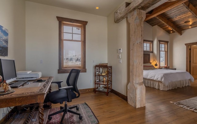 office area featuring wood finished floors, plenty of natural light, baseboards, and wood ceiling