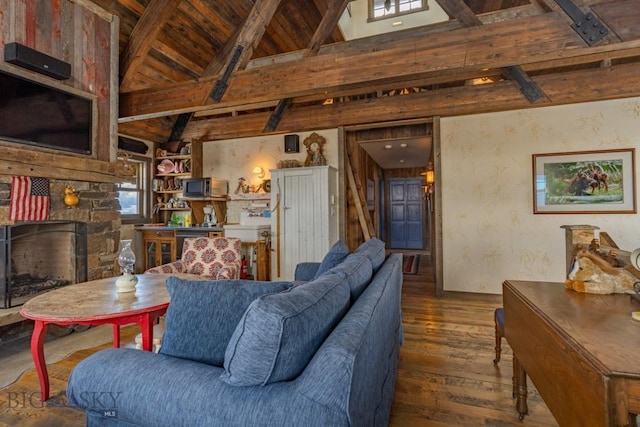 living area featuring beamed ceiling, hardwood / wood-style flooring, wooden ceiling, and high vaulted ceiling