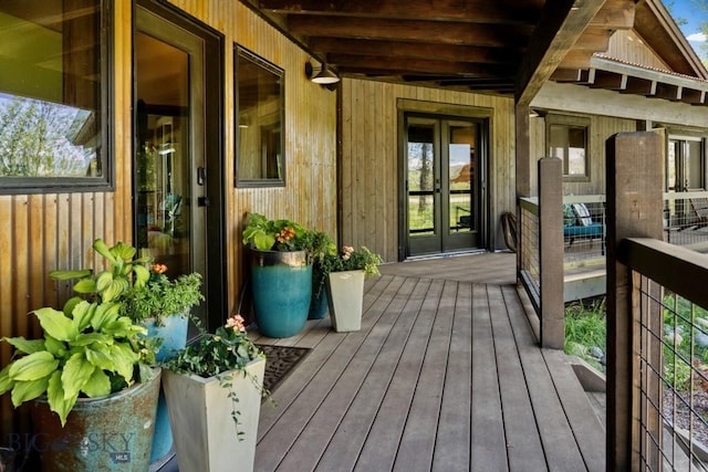 wooden deck featuring french doors