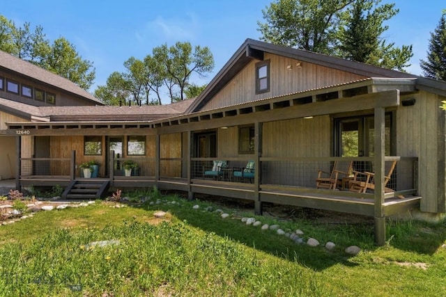 back of property with a yard