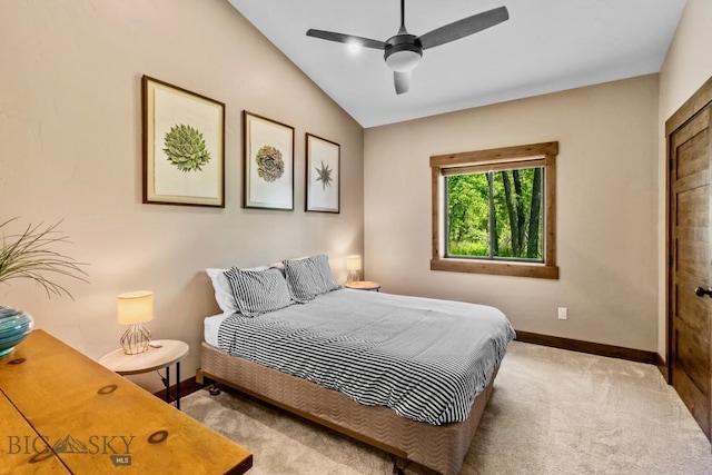 bedroom with baseboards, carpet, vaulted ceiling, and a ceiling fan