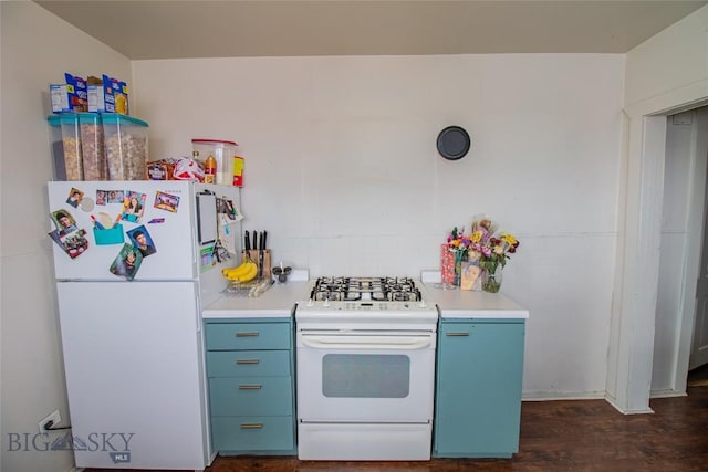 1048 S Wyoming St, Butte, MT 59701 - kitchen with white appliances, blue cabinetry, light countertops, dark wood finished floors, and tasteful backsplash