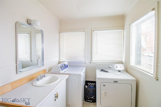 1048 S Wyoming St, Butte, MT 59701 - laundry area with washer and dryer, cabinet space, and ornamental molding