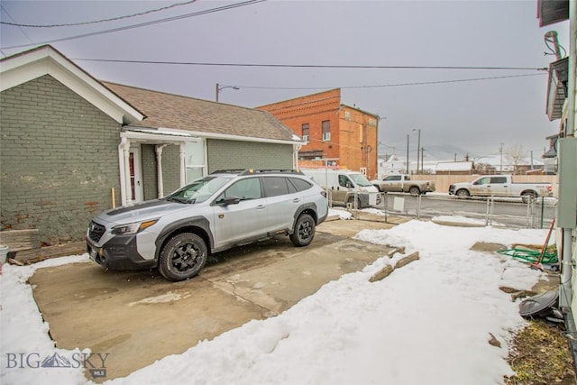1048 S Wyoming St, Butte, MT 59701 - snow covered parking area featuring fence