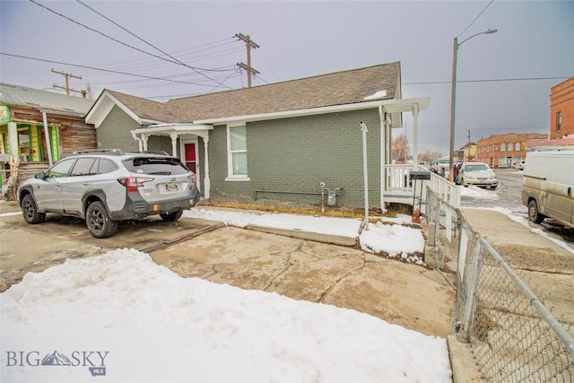 1048 S Wyoming St, Butte, MT 59701 - view of front of house with brick siding and fence