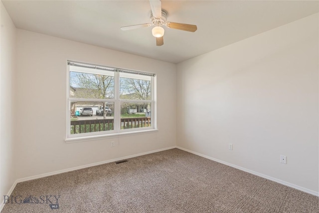 550 Green Tree, Belgrade, MT 59714 - unfurnished room with carpet floors, baseboards, and a ceiling fan