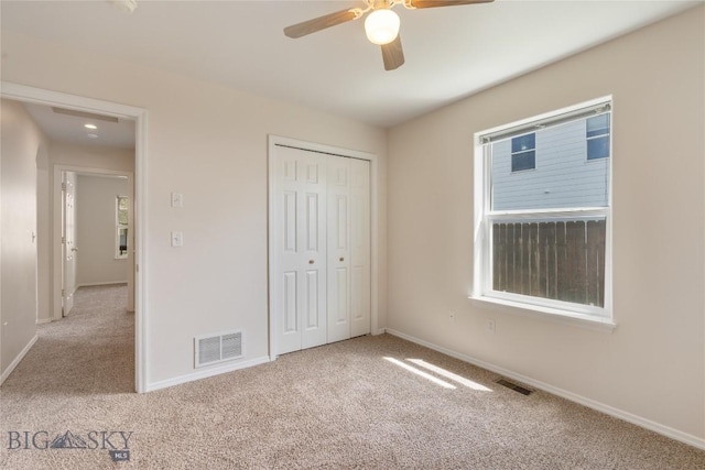 550 Green Tree, Belgrade, MT 59714 - unfurnished bedroom featuring carpet, baseboards, and a closet
