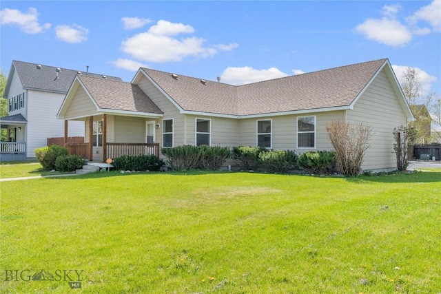 550 Green Tree, Belgrade, MT 59714 - view of front of home featuring a front yard, roof with shingles, and a porch