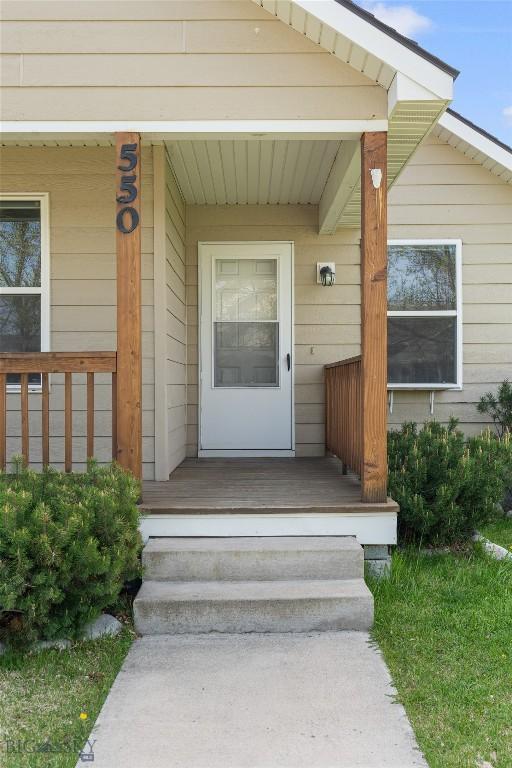 550 Green Tree, Belgrade, MT 59714 - doorway to property featuring a porch
