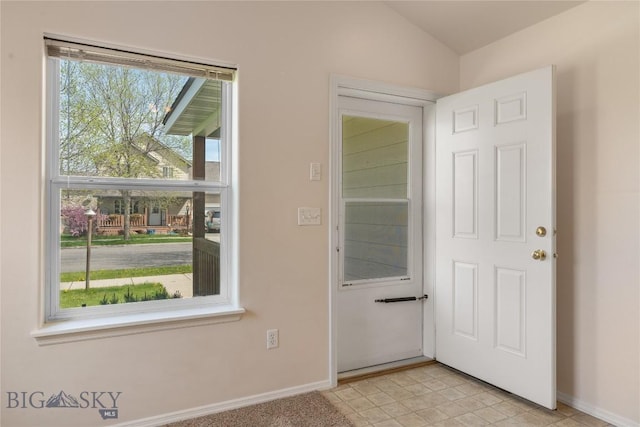 550 Green Tree, Belgrade, MT 59714 - doorway to outside featuring baseboards and vaulted ceiling