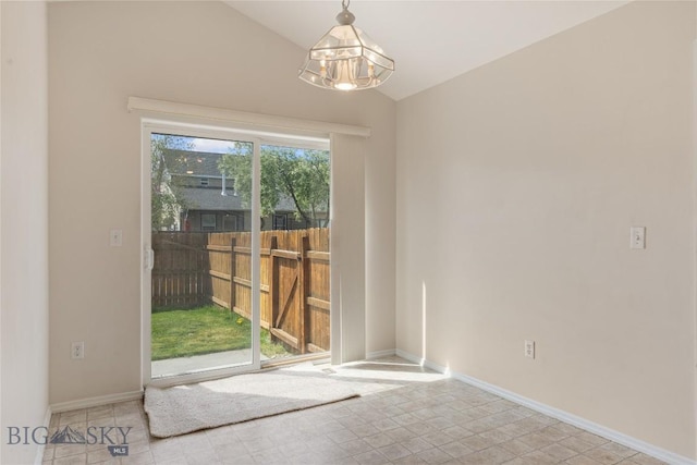 550 Green Tree, Belgrade, MT 59714 - unfurnished room with vaulted ceiling, a chandelier, baseboards, and tile patterned floors