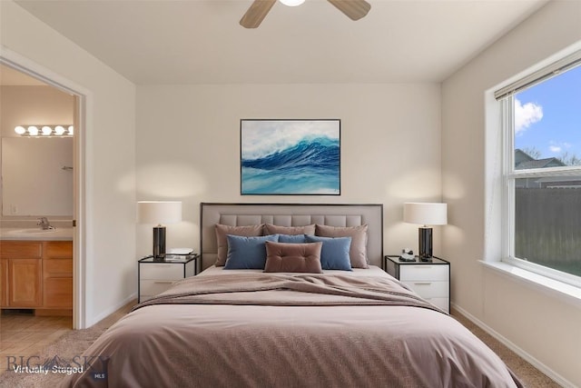 550 Green Tree, Belgrade, MT 59714 - bedroom featuring a sink, baseboards, ensuite bath, and ceiling fan