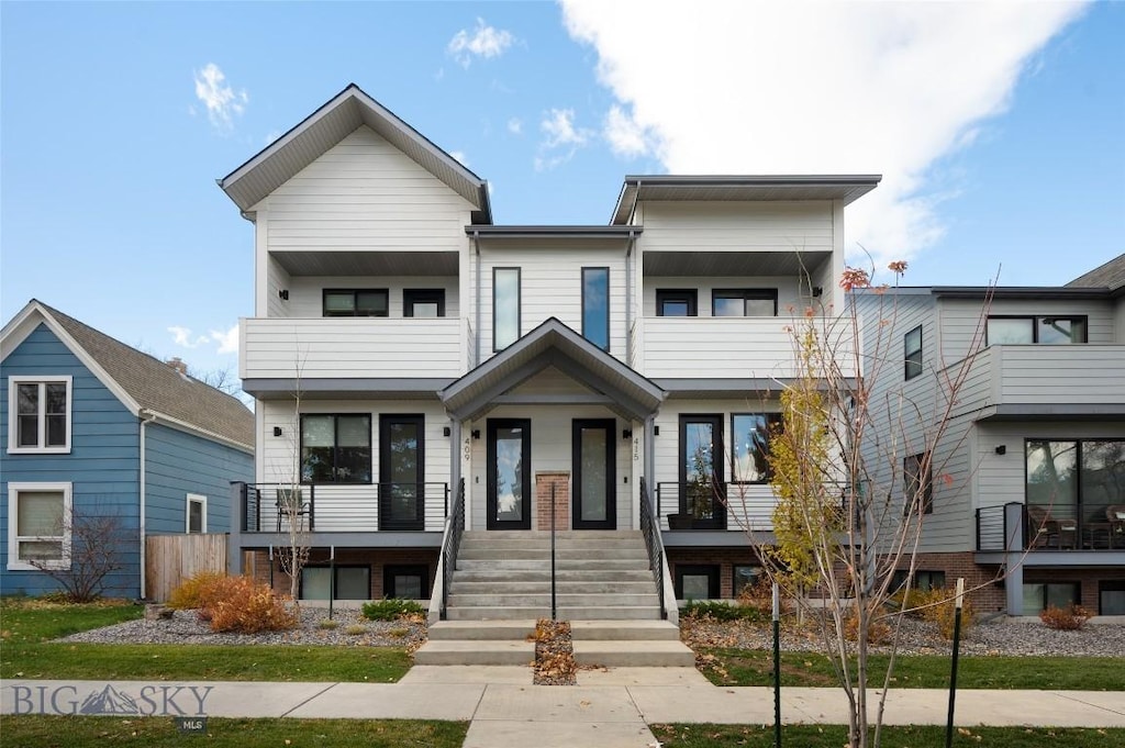 415 N Willson Ave, Bozeman, MT 59715 - view of property featuring a balcony and covered porch