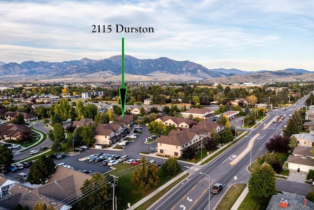 aerial perspective of suburban area featuring a mountain backdrop