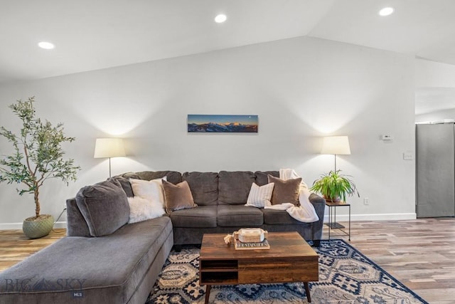 285 Hereford Dr, Belgrade, MT 59714 - living room with baseboards, wood finished floors, vaulted ceiling, and recessed lighting