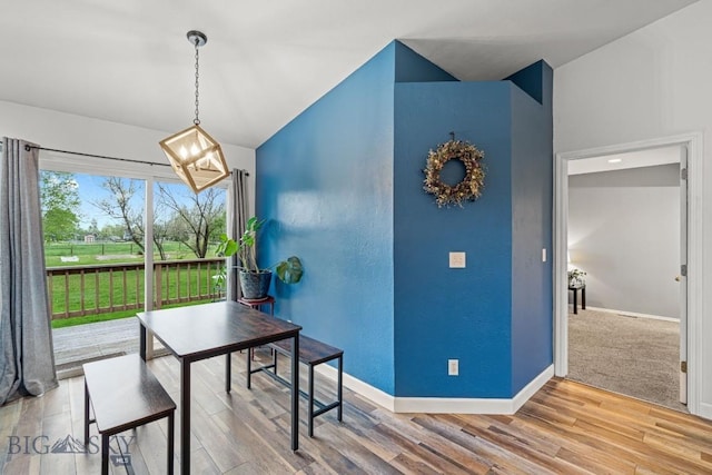 285 Hereford Dr, Belgrade, MT 59714 - dining area featuring baseboards, wood finished floors, and lofted ceiling