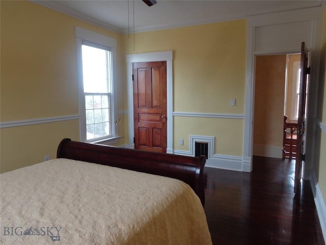 523 Hickory, Anaconda, MT 59711 - bedroom featuring wood finished floors, multiple windows, baseboards, and crown molding