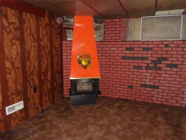 523 Hickory, Anaconda, MT 59711 - finished basement with carpet, a paneled ceiling, and brick wall