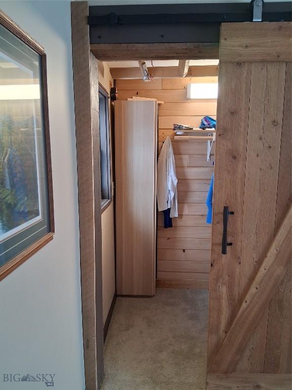 967 Mt Highway 2 W, Whitehall, MT 59759 - hallway featuring carpet and wooden walls