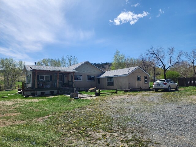 967 Mt Highway 2 W, Whitehall, MT 59759 - back of house featuring a yard and covered porch
