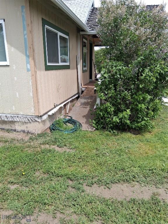 967 Mt Highway 2 W, Whitehall, MT 59759 - view of side of home featuring roof with shingles