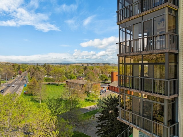 view of yard with a balcony