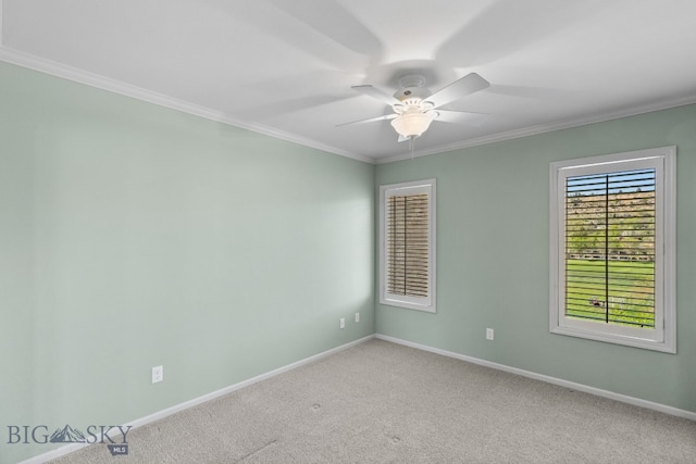 spare room with crown molding, baseboards, light carpet, and a ceiling fan