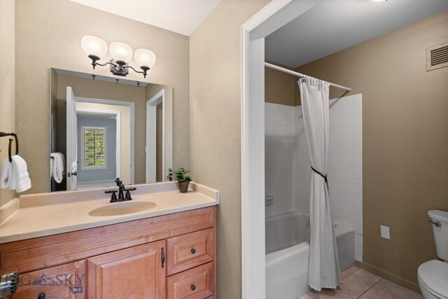 full bath with toilet, tile patterned flooring, vanity, shower / bath combination with curtain, and baseboards