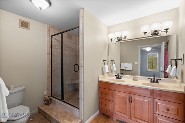 bathroom with a stall shower, toilet, baseboards, tile patterned floors, and ceiling fan