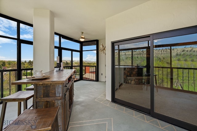 sunroom / solarium with carpet floors and plenty of natural light