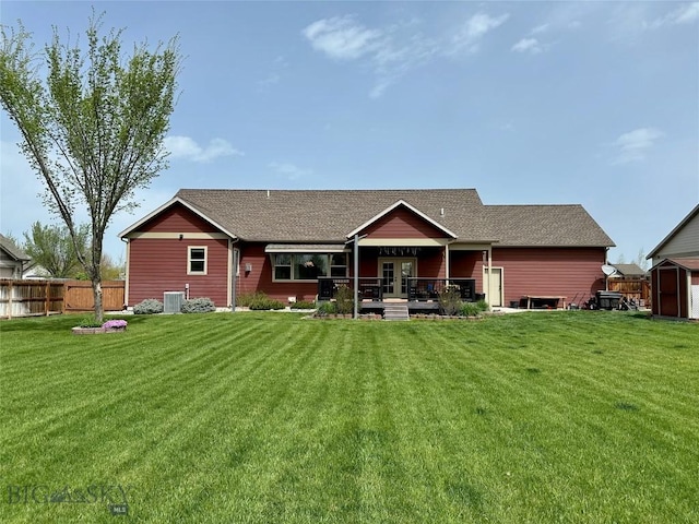 72 River Woods Rd, Belgrade, MT 59714 - rear view of house with central AC, french doors, roof with shingles, and a wooden deck