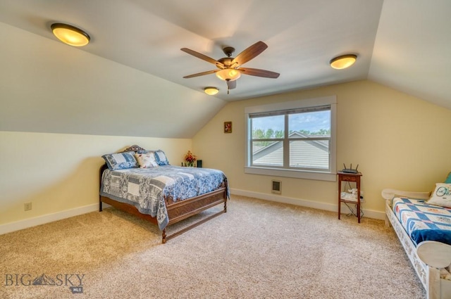 72 River Woods Rd, Belgrade, MT 59714 - carpeted bedroom featuring lofted ceiling, baseboards, and ceiling fan