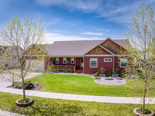 72 River Woods Rd, Belgrade, MT 59714 - view of front of house featuring a front yard and a shingled roof