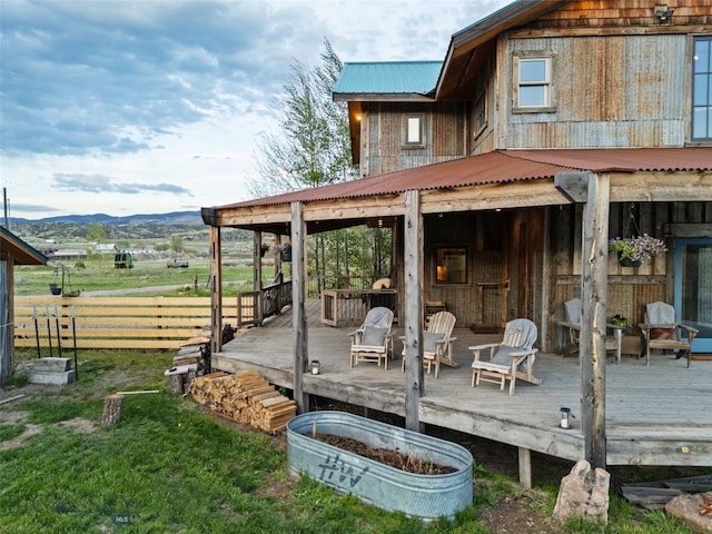 wooden terrace with fence and a mountain view