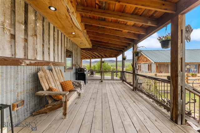 wooden deck with grilling area