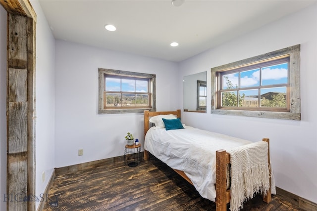 bedroom featuring recessed lighting, wood finished floors, and baseboards
