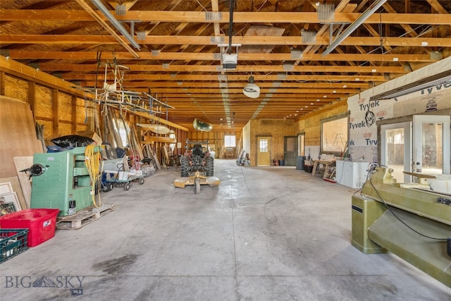 miscellaneous room with concrete floors and a garage