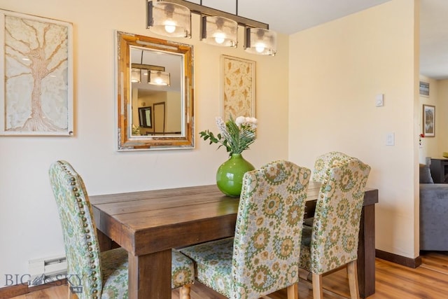 dining room with wood finished floors