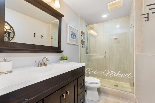 full bathroom with toilet, a shower stall, vanity, and tile patterned floors