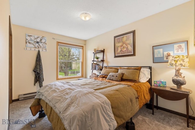 carpeted bedroom with a baseboard heating unit and baseboards