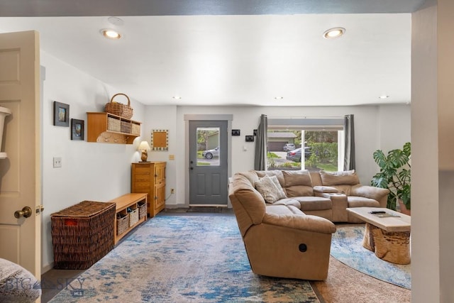 living room with recessed lighting and baseboards