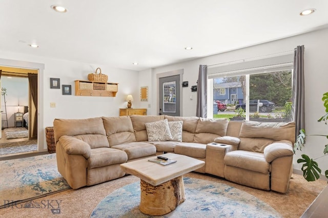 carpeted living area with recessed lighting