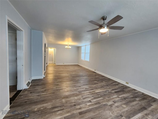 unfurnished room with a chandelier, dark wood-type flooring, baseboards, a ceiling fan, and ornamental molding