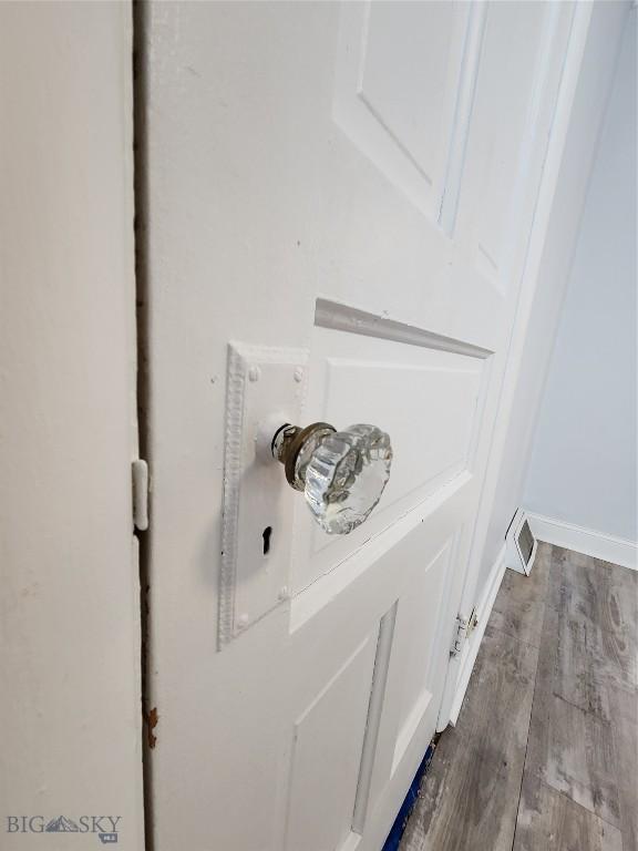 detailed view of wood finished floors and baseboards