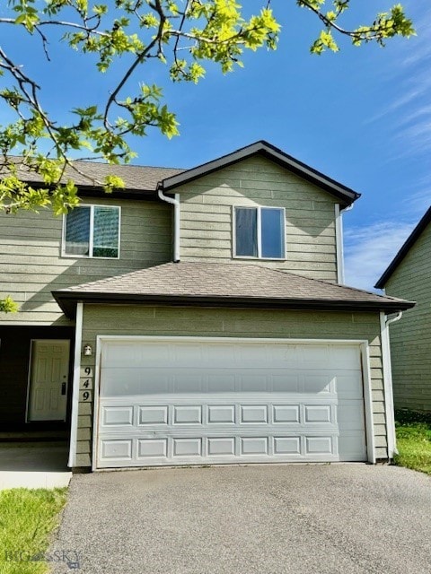 view of front of property with driveway and an attached garage