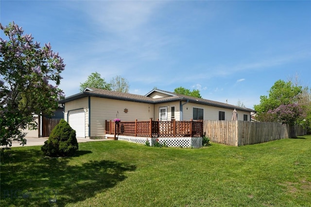 115 8th, Belgrade, MT 59714 - back of property featuring an attached garage and a deck