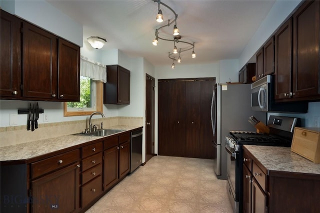 115 8th, Belgrade, MT 59714 - kitchen with appliances with stainless steel finishes, a sink, dark brown cabinetry, and light flooring