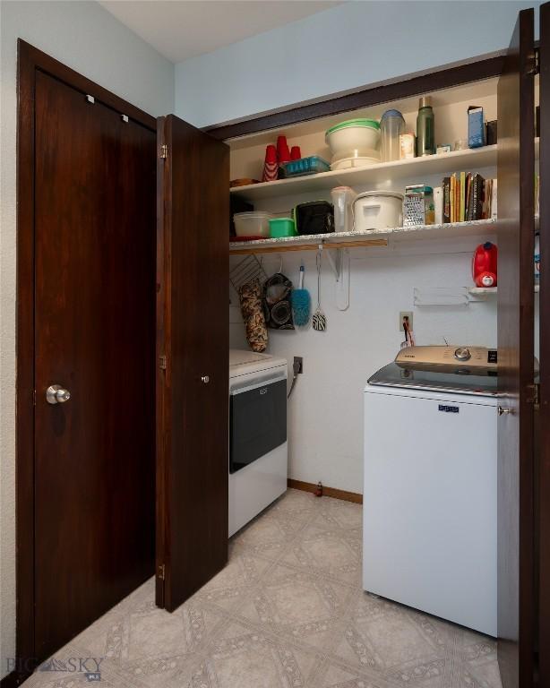 115 8th, Belgrade, MT 59714 - laundry room with light floors and separate washer and dryer