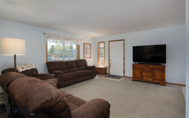 115 8th, Belgrade, MT 59714 - living room featuring light colored carpet and baseboards
