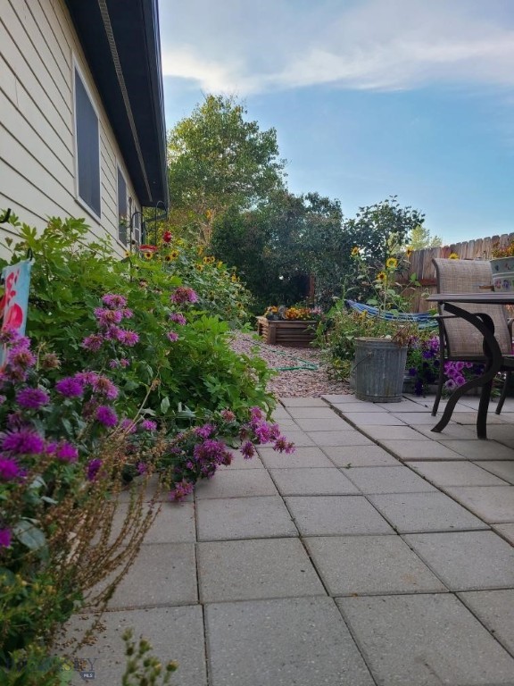 115 8th, Belgrade, MT 59714 - view of patio / terrace featuring fence